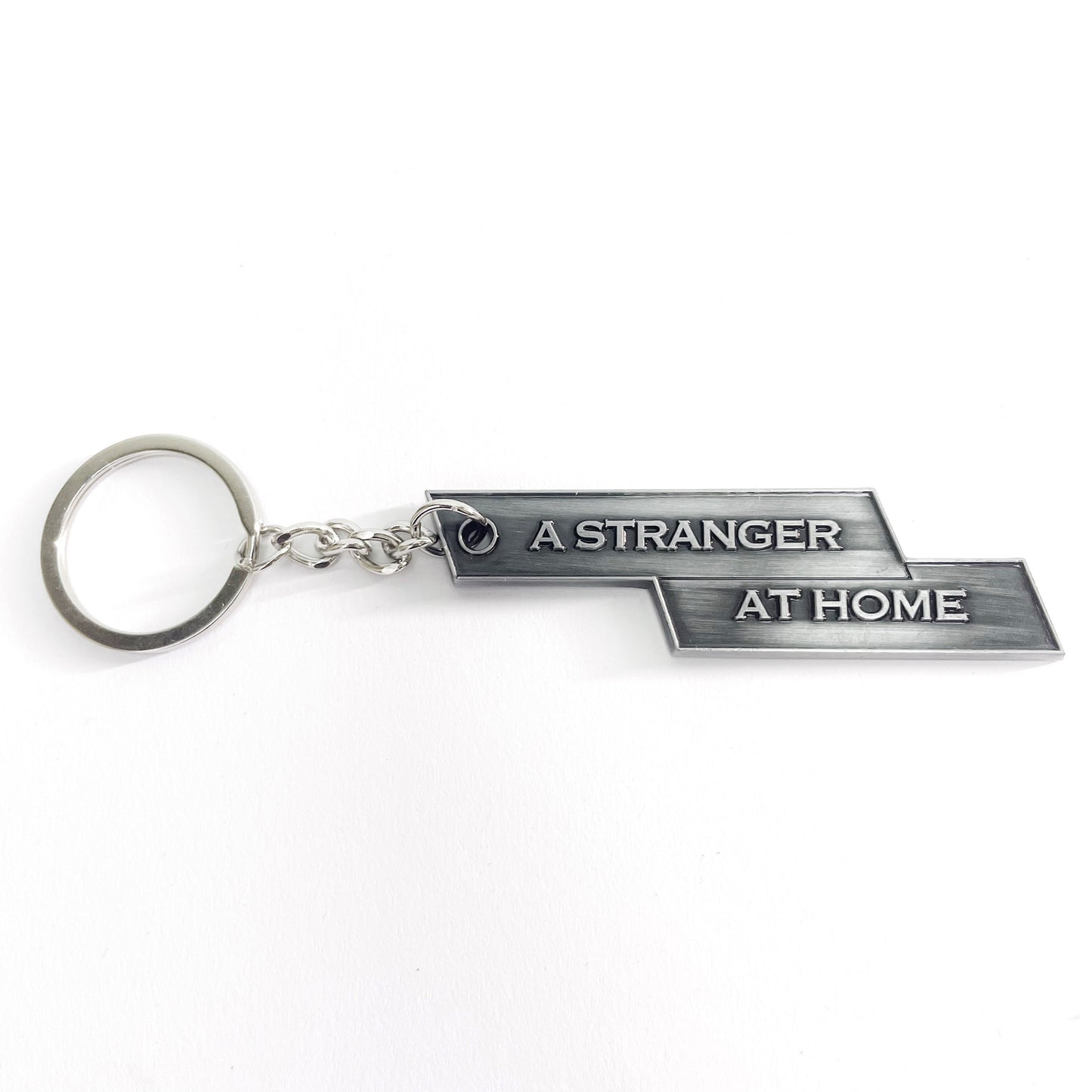 "A STRANGER AT HOME" KEYCHAIN