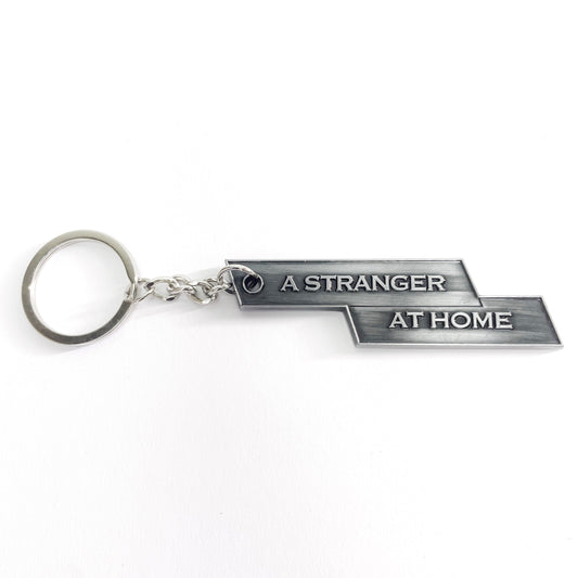 "A STRANGER AT HOME" KEYCHAIN